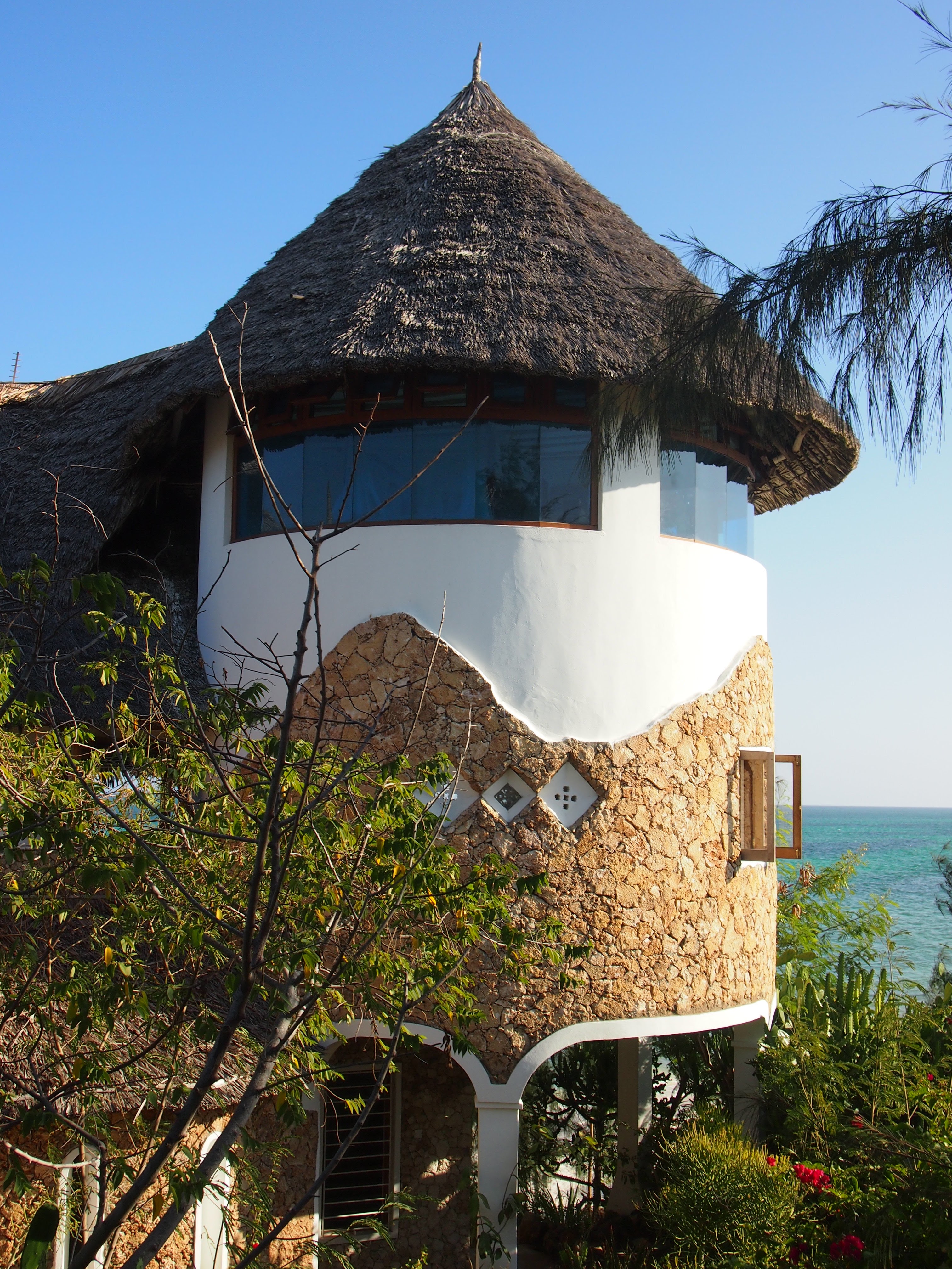 The Beach House exterior with thatched roof